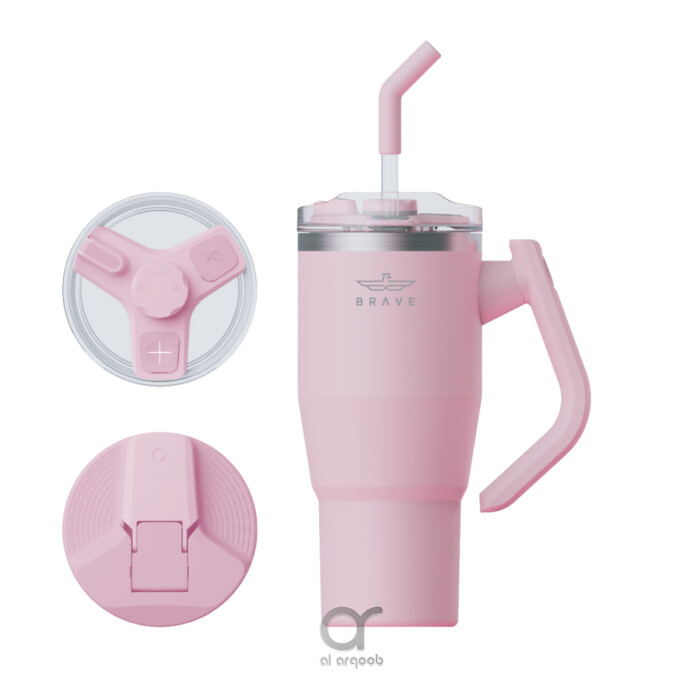 A pink-toned 40 oz Brave Tumbler Mug with a 180° rotating handle. Shown alongside two interchangeable lids—a safety lid with a flip-up closure and a G-lid designed for straw use—plus a reusable straw. The mug’s tapered shape fits standard car cup holders,